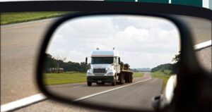 truck in car side mirror
